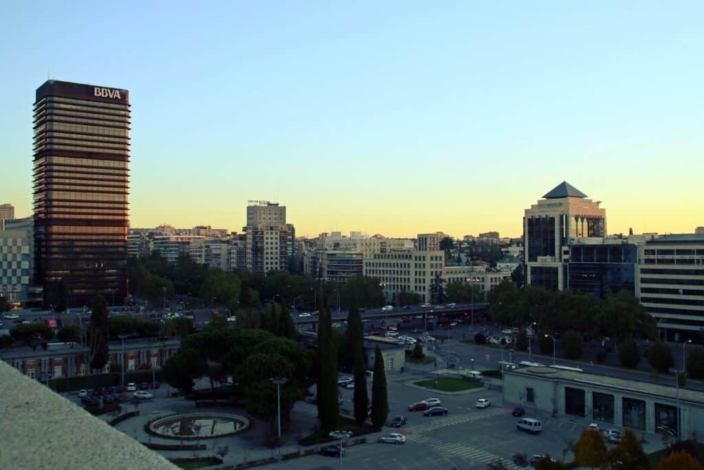 Public park and gardens of the Nuevos Ministerios complex at dawn.