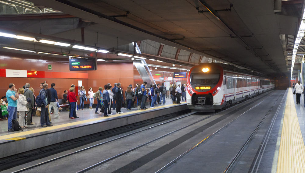 A metro train is arriving at a metro station in Madrid